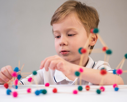 boy-playing-with-chemistry-game-indoors.jpg