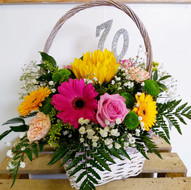 Pink and yellow mixed flower basket