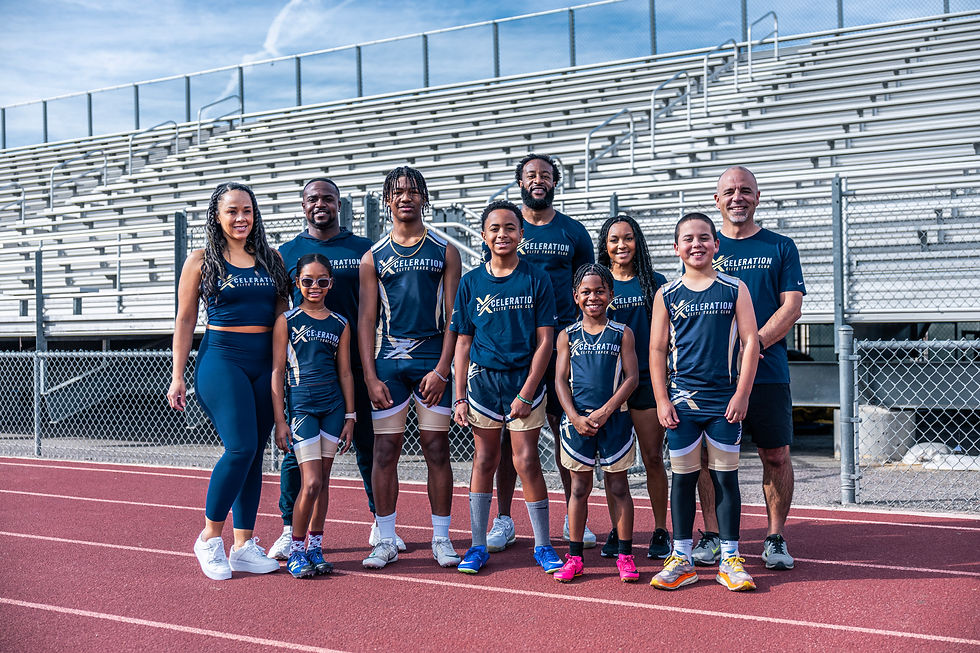 Group of athletes posing trackside wearing EXCELERATION ELITE uniforms.