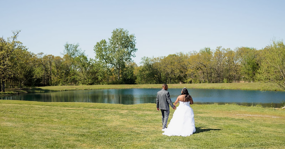 bride_groom_walking toward pond_edited_edited.png