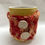 Thumbnail: Knitted Mug Cosy - Red and Orange