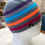 Thumbnail: Crocheted Hat - Dark grey with thick multicoloured stripes