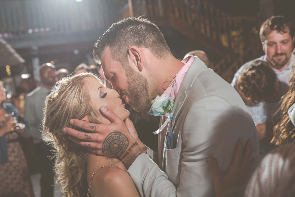Bride and groom sharing a laugh during their Kent wedding ceremony.