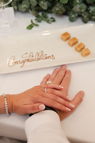 Bride and groom during their wedding at The Spa Hotel Tunbridge Wells, surrounded by beautiful gardens and natural light.