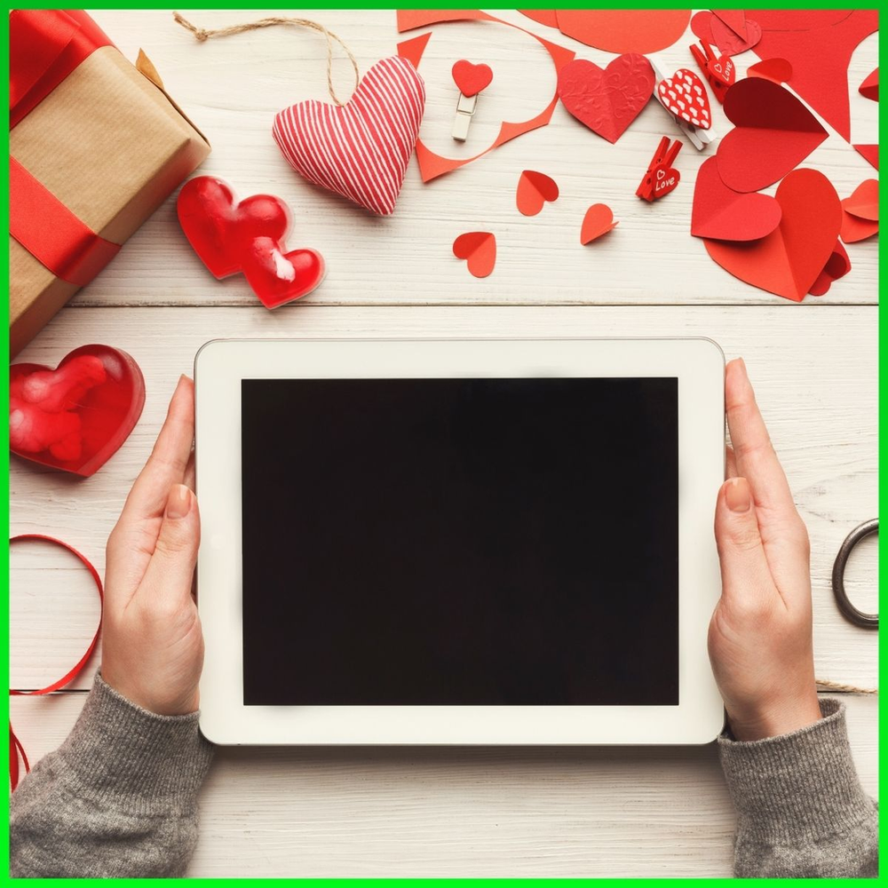 Tablet surrounded by valentines arts and crafts
