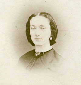 Helen Maria Edwards - old photograph of a young woman to her bust with a modest dress button to her nec. A brooch sits at her neck and she is wearing large round dangle earrings. Her hair is parted down the middle and pulled back at her nape. She has a serene expression.