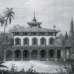 Two story Italianate mansion with wrap around porch, 10 windows, and a cupola atop the home with a long spire.