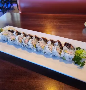 Sushi roll on plate at Kamiya Sushi restaurant, fresh ingredients.