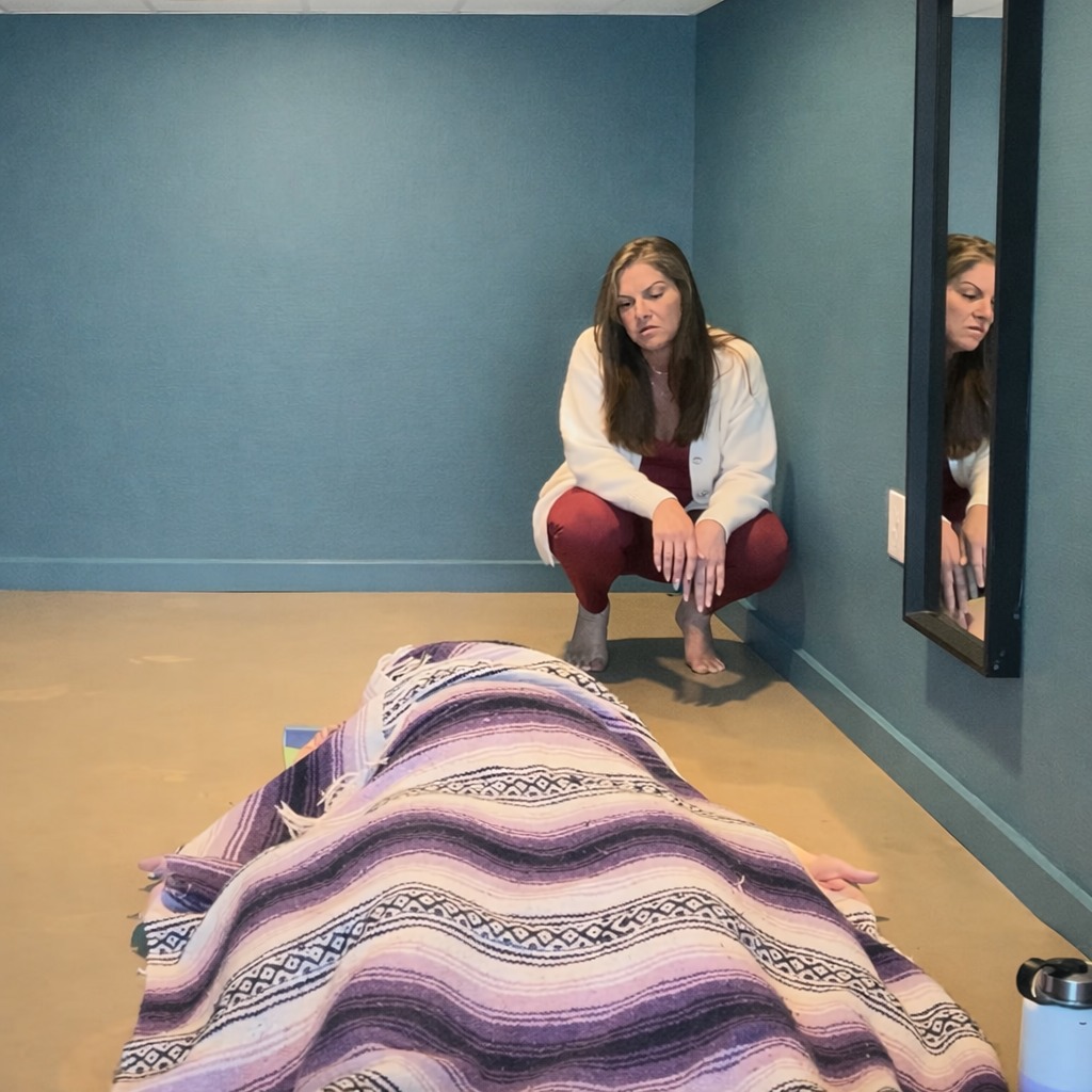 Heidi Pancake, breathwork facilitator, with a client in session