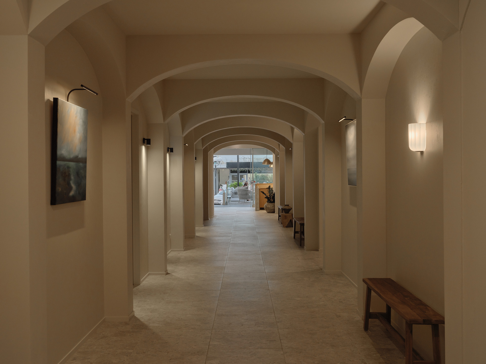 The long arched corridor of Twenty Two Mokoia, benches and artwork along its length
