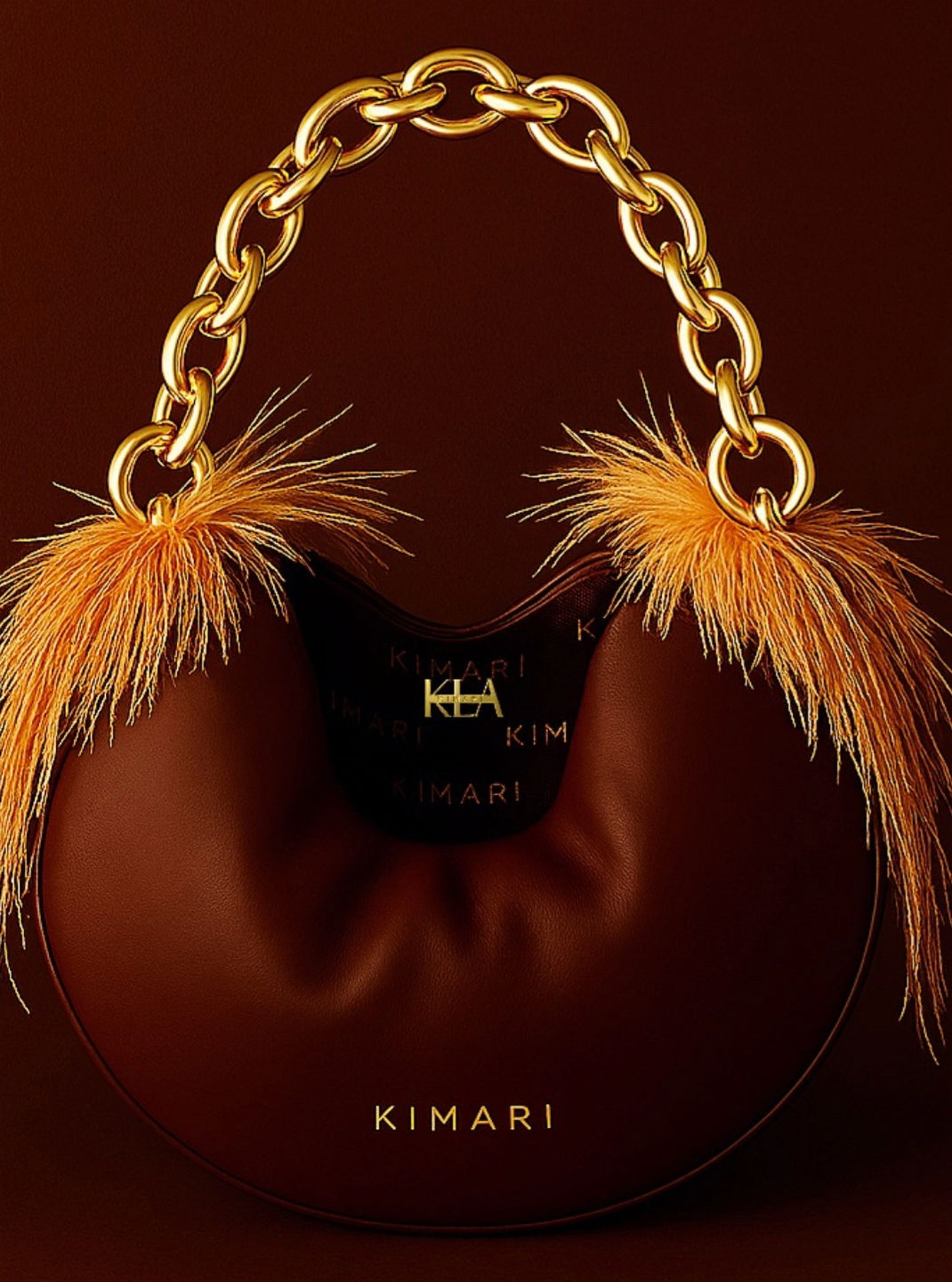 Luxury Handbag in chocolate calfskin semi-round shape feather accent near each strap ring, gold chain strap, printed lining