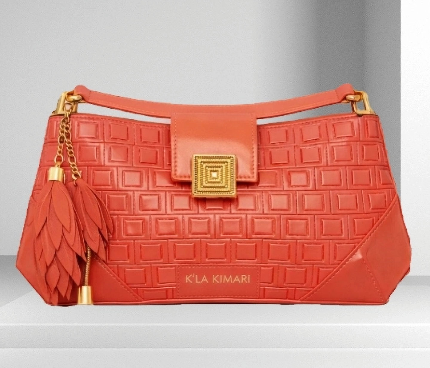 Coral calfskin embossed handbag, square pattern, feather charm , glossy camel square flap and strap and square lock closure