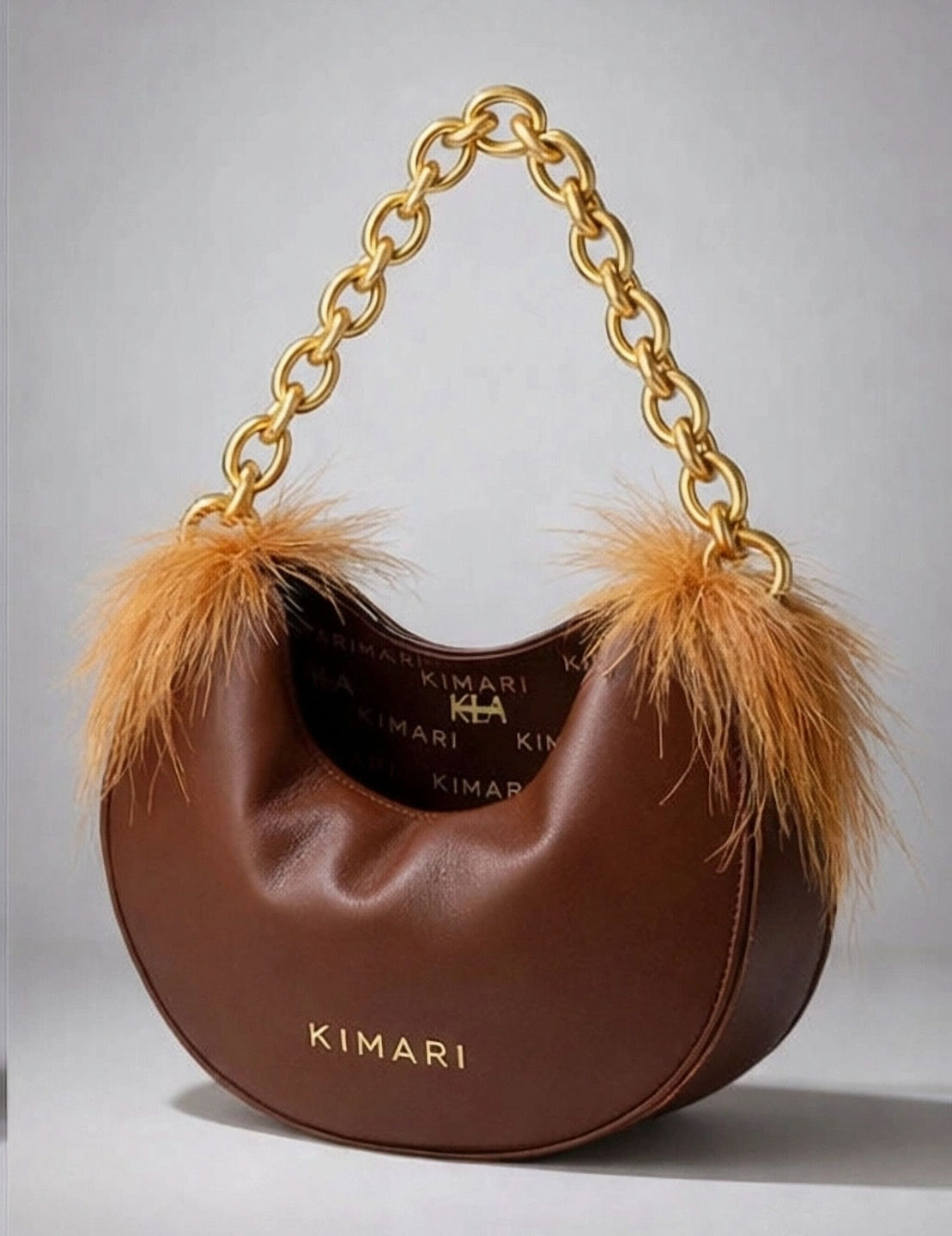 Luxury Handbag in chocolate calfskin semi-round shape feather accent near each strap ring, gold chain strap, printed lining