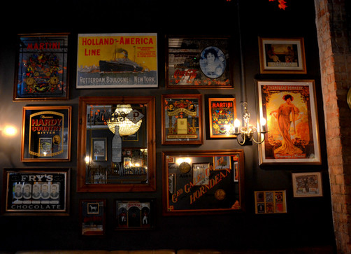 Frames on wall at the Alpaca, independent pub in Islington, North London.