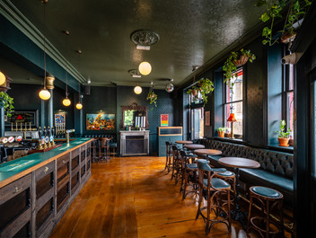 Tables, chairs, benches and bar at the Earl of Derby, independent pub in Telegraph Hill, South East London