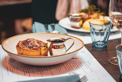 Pie with gravy sauce at the Bull and Egret, independent pub in Covent Garden near Temple, Central London.