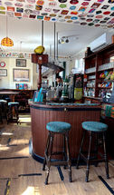 Stools at the bar at the Trafalgar, independent pub in Wimbledon, South West London