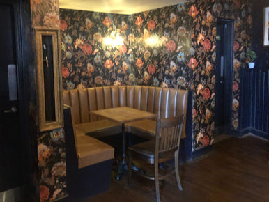 Table and benches at the Railway Tavern, independent Dalston pub in London.