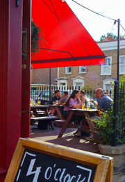 Beer garden with awning at the Earl of Derby, independent pub in Telegraph Hill, South East London