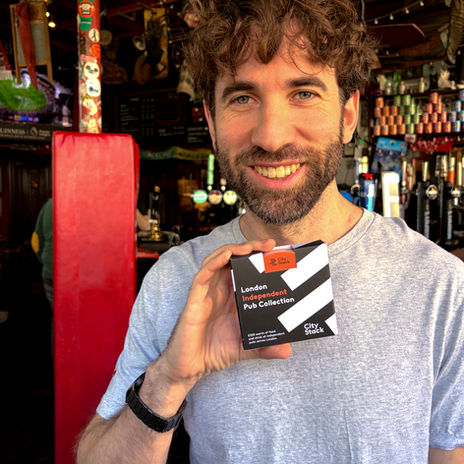 Londoner with a pack of pub vouchers