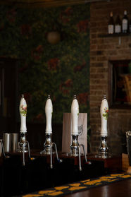 Hand beer pumps at the Wolf’s Tavern, independent pub in Deptford, South East London.