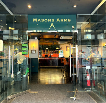 Entrance door at the Masons Arms, independent pub in the City of London, located between Bank and Moorgate.