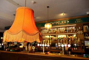 Vintage hanging lamp, bar at the Montpelier, independent pub in Peckham, South East London