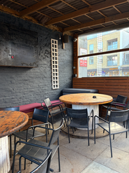 Table, chairs in the beer garden at the Garden Shed, a Wimbledon independent pub in South West London.