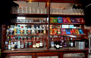 Bottles of alcohol and shelves at the Trafalgar, independent pub in Wimbledon, South West London
