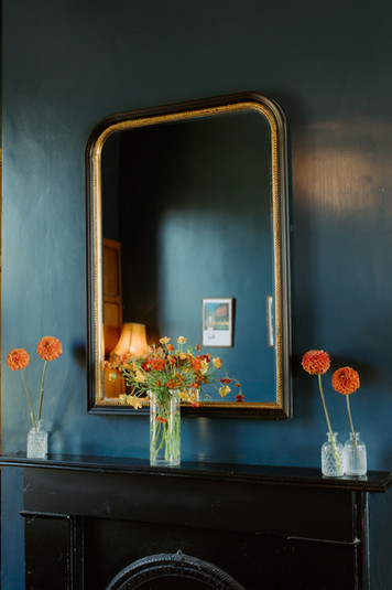 Mirror on top of fireplace with vases at the Earl of Derby, independent pub in Telegraph Hill, South East London