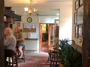 Customers at the bar at the Star of Greenwich, independent community pub in London.