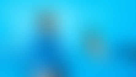 Two men in a blue office setting. One stands talking on a phone; the other sits, listening. Blue tones dominate the modern workspace.