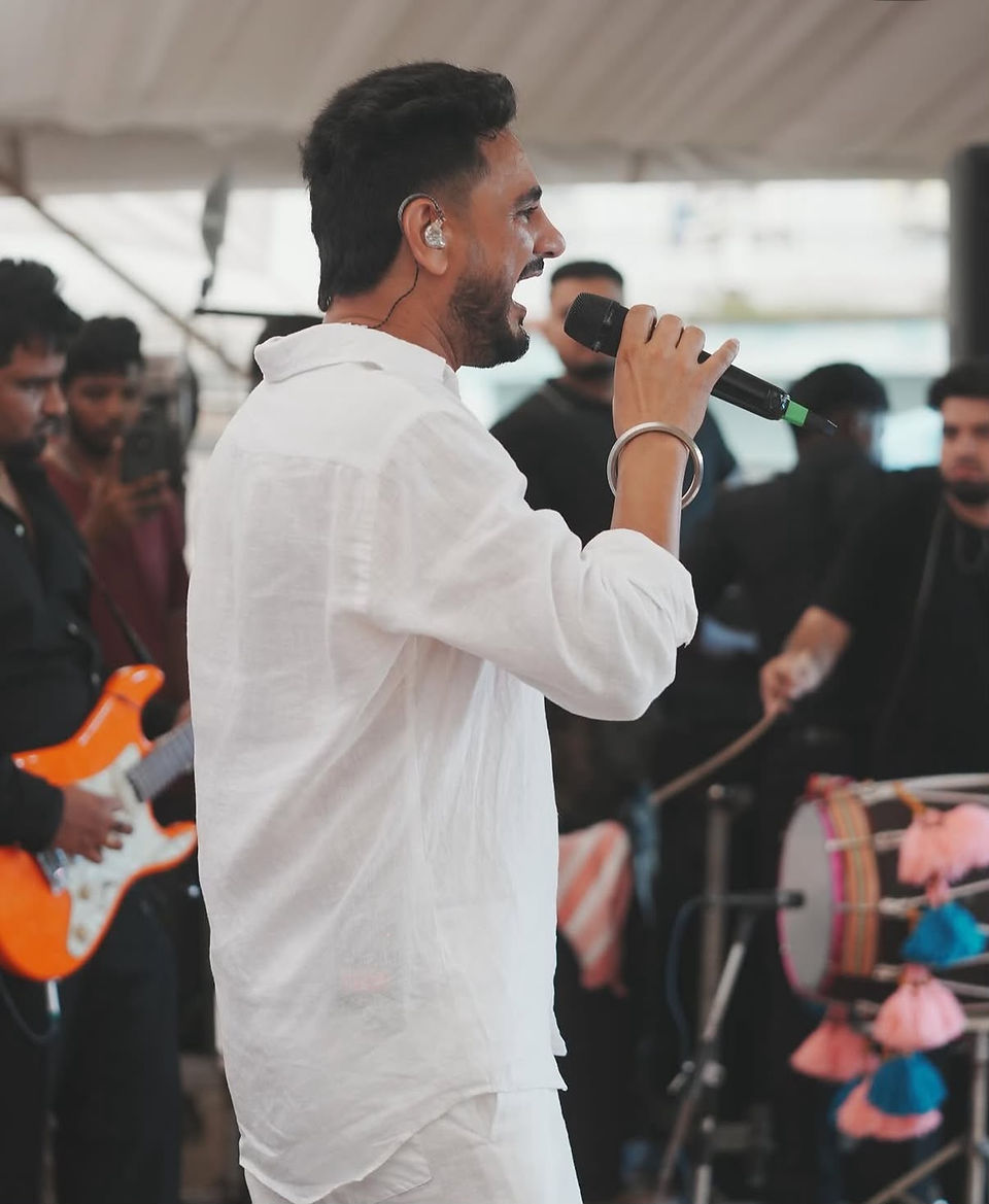 Artist performing on stage during the Baal Mela cultural celebrations in Nagrota Bagwan.
