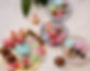 Gold Platter and Plates filled with Cookies, Baked Meringues, Cupcakes, Macarons and Choco