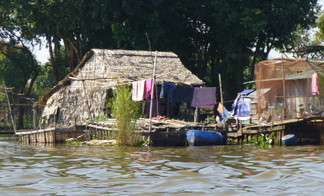 Small floating houses along the shores of the Mekong