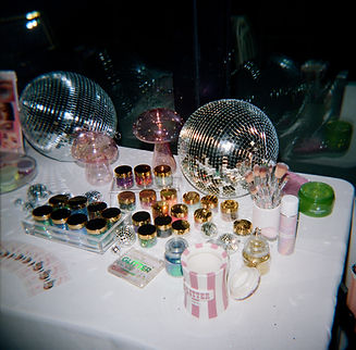 Glitter bar shows plethora of glitter on a table at a wedding.