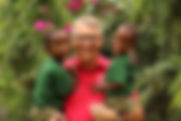 Founder Daniel Preuss at Streetkids Internationals Montessori Kindergarten with two children