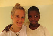 Louisa with orphan child at Tumaini Montessori Kindergarten