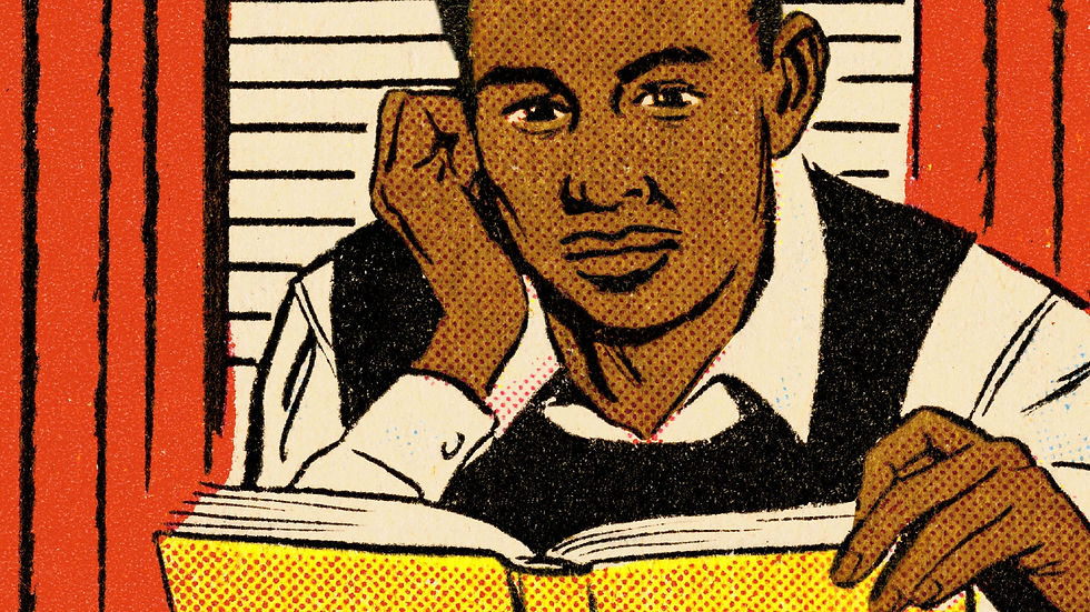 A picture of a male student reading a book