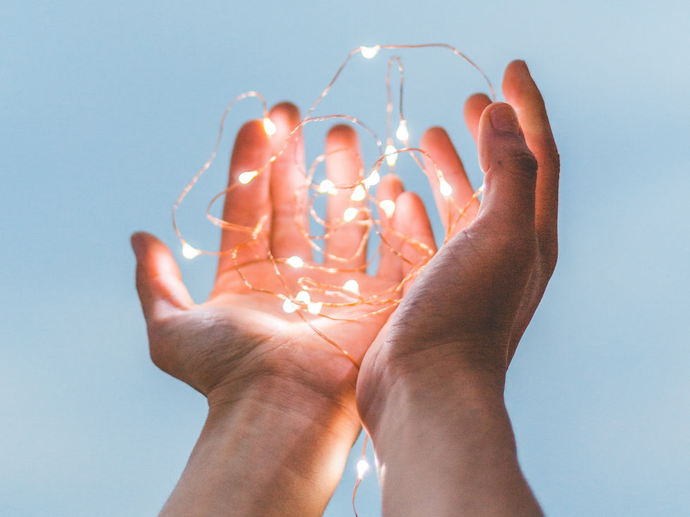 hands holding lights reiki