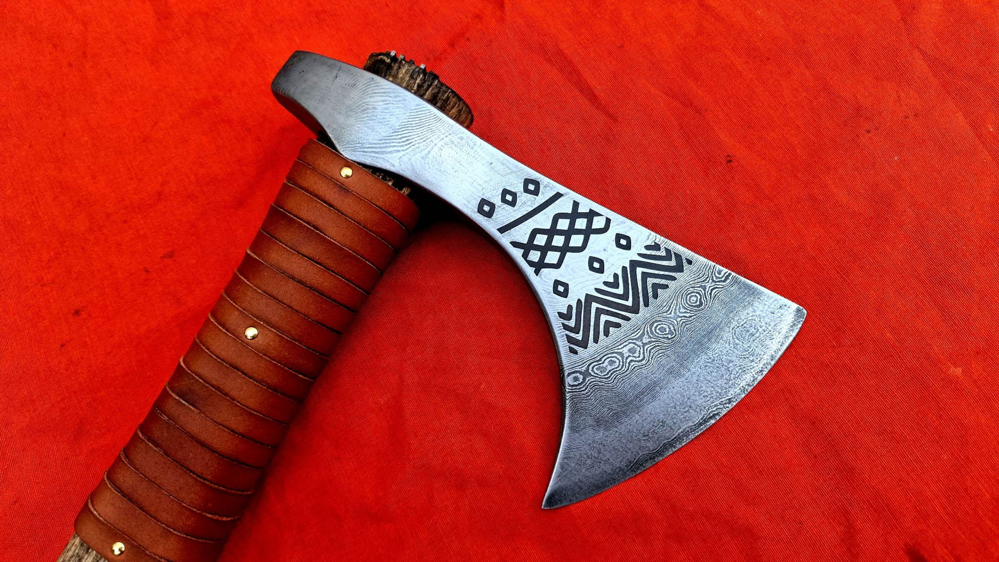 Damascus tomahawk with engraved head
