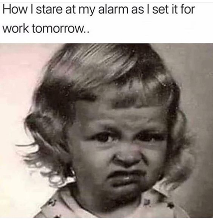 A young girl with a disgusted face captioned with "How I stare at my alarm as I set it for work tomorrow."