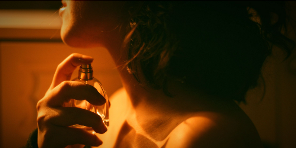 woman applying perfume