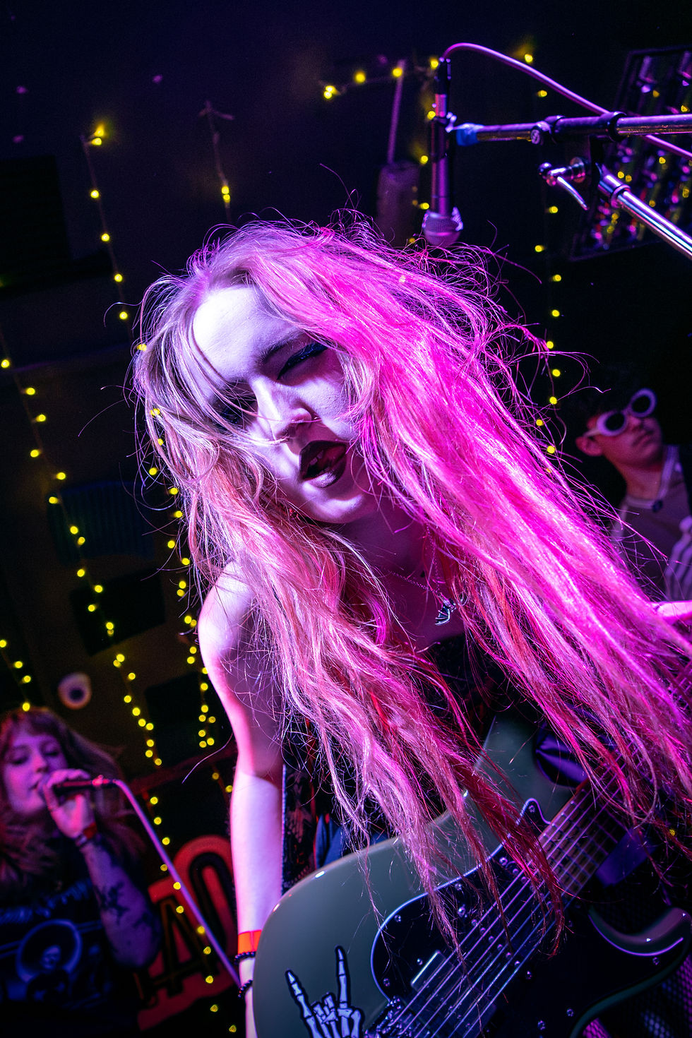 A female band member in a professional photograph