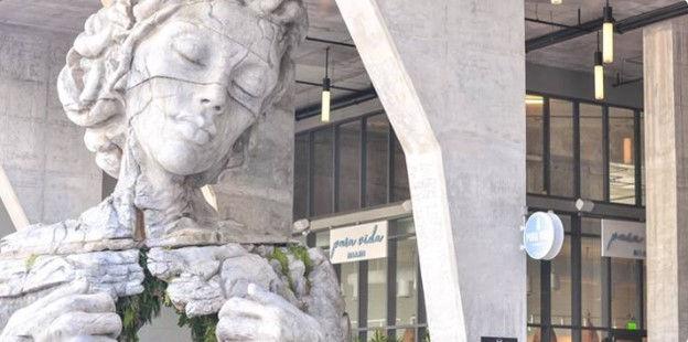 Statue of a woman in front of the Pura Vida Ft. Lauderdale restaurant