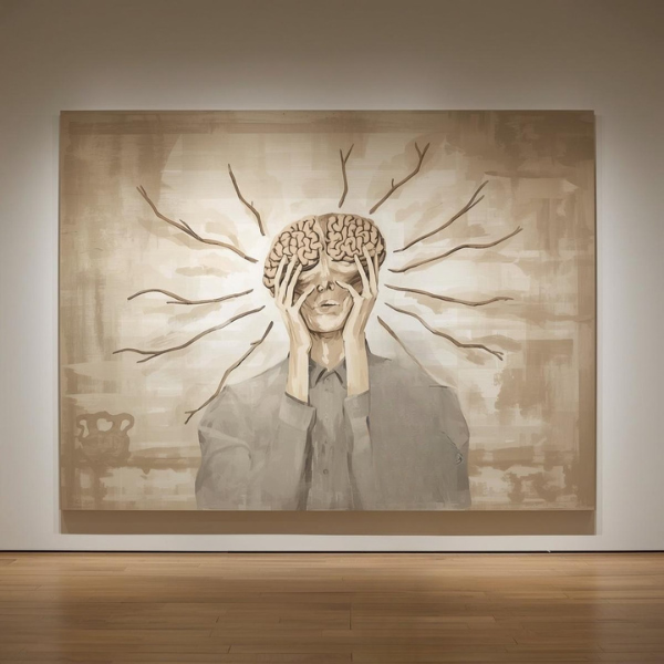 Persona sosteniendo su cabeza con ramas que brotan del cerebro, representando el tratamiento de la ansiedad en Palma de Mallorca.