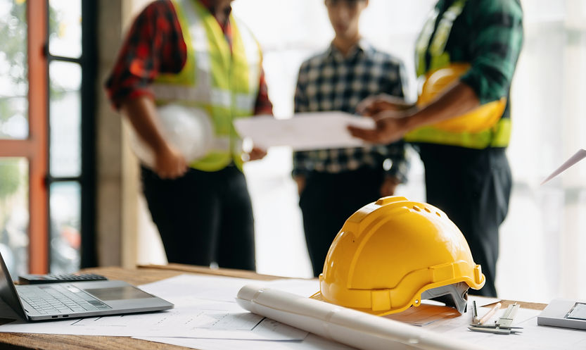 Engineer teams meeting working together wear worker helmets hardhat on construction site i
