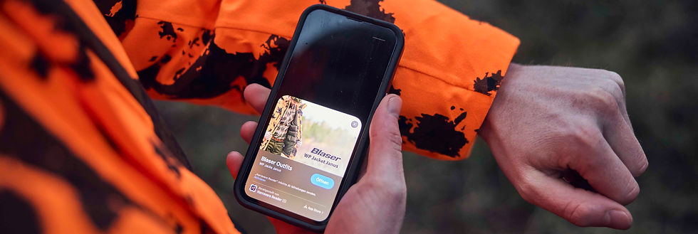 Smartphone shows a product preview for hunting clothing in an app.