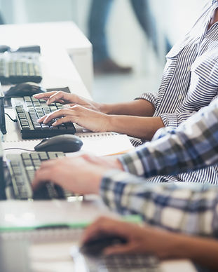 Students Typing at Their Computers