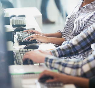 Students Typing at Their Computers